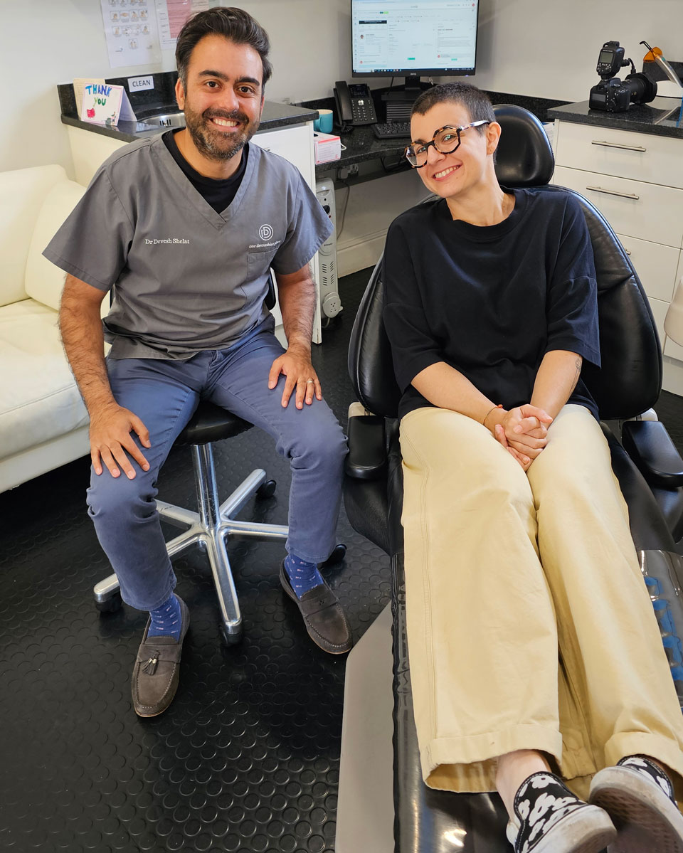 Dr Devesh Shelat with a real patient in the treatment room