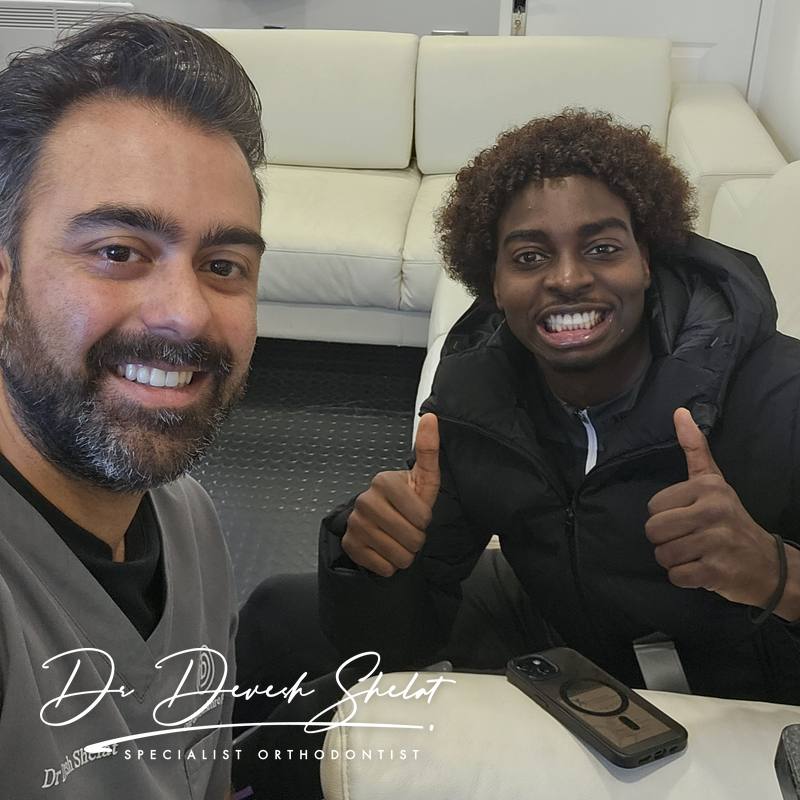 A real patient smiling after finishing orthodontic treatment with Dr Dev Orthodontics
